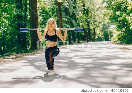 Sports girl in a park Sports girl in a park 49410502