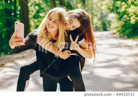 Sports girls in a park Sports girls in a park 49410531