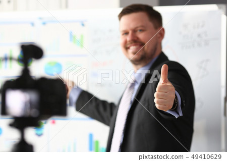 Male in suit and tie show confirm sign Male in suit and tie show confirm sign 49410629