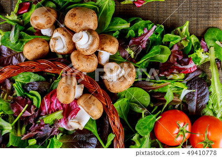 Still life of vegetables a on rustic wooden board 49410778