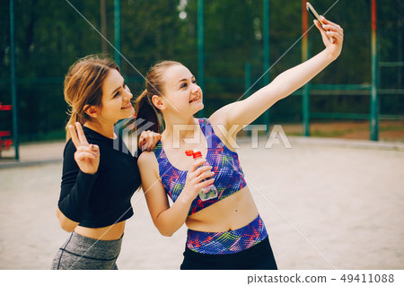 Sports girls in a park Sports girls in a park 49411088