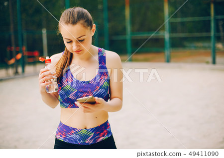 Sports girl in a park Sports girl in a park 49411090