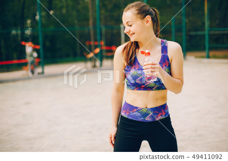 Sports girl in a park Sports girl in a park 49411092