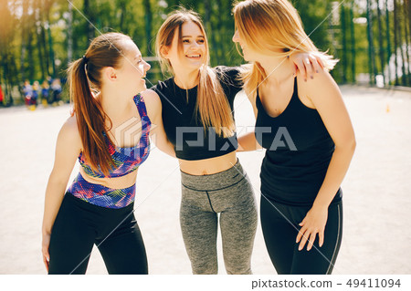 Sports girls in a park Sports girls in a park 49411094
