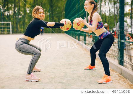 Sports girls in a park Sports girls in a park 49411098