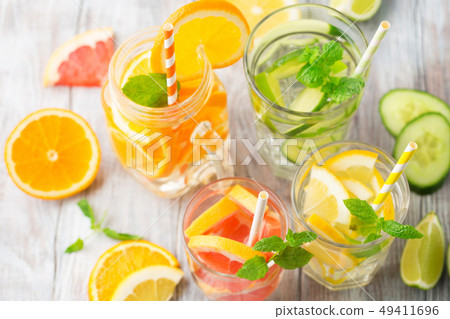 Infused water with fresh citrus fruits and ice Infused water with fresh citrus fruits and ice 49411696