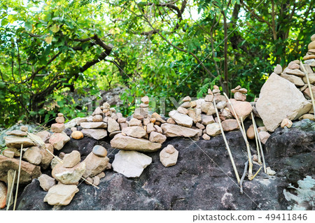 rock is arranged as a pagoda for worship of lord 49411846
