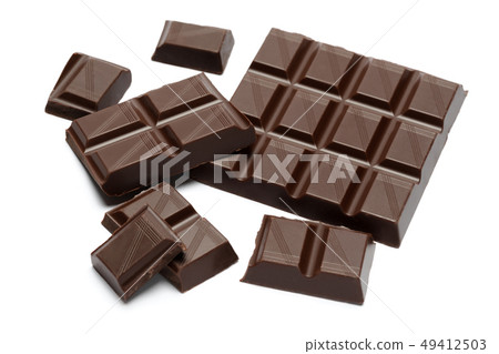 Dark organic chocolate pieces isolated on white background 49412503