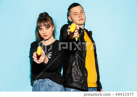 Close up fashion portrait of two young pretty hipster teens Close up fashion portrait of two young pretty hipster teens 49413377