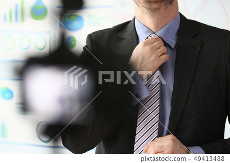 Male arm in blue suit set tie closeup on Male arm in blue suit set tie closeup on 49413488