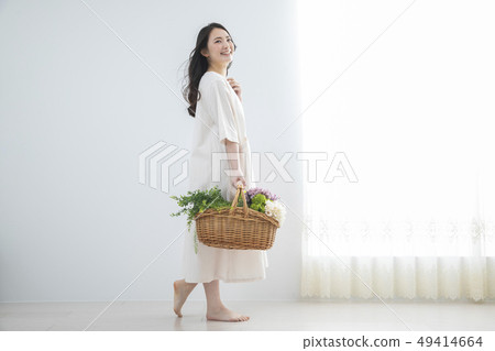 Woman with flower basket 49414664