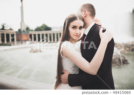 Luxury married wedding couple, bride and groom posing in old city 49415060