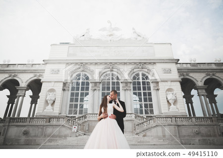 Perfect couple bride, groom posing and kissing in their wedding day Perfect couple bride, groom posing and kissing in their wedding day 49415110
