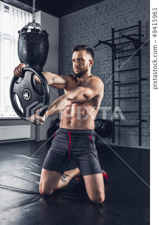 The athlete trains hard in the gym. Fitness and healthy life concept. 49415961