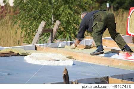 Workers cut the roof in the house Workers cut the roof in the house 49417488