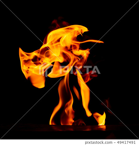 Red flame of fire on a black background Red flame of fire on a black background 49417491