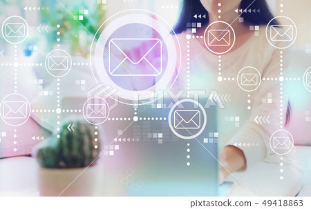 Emails with woman using her laptop 49418863