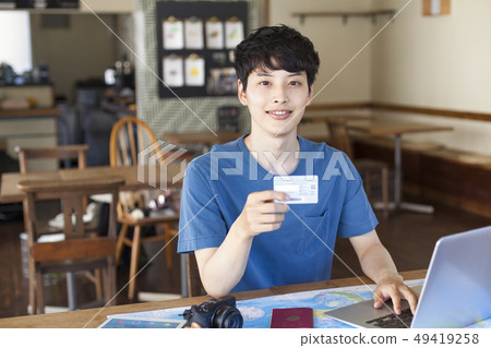 A young man who plans to travel abroad A young man who plans to travel abroad 49419258