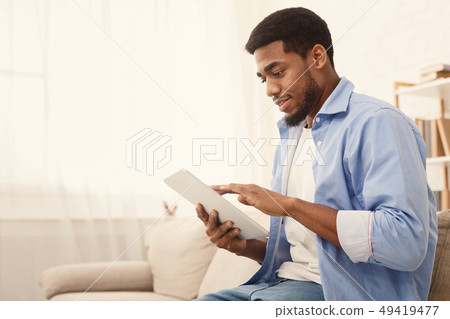 Young african american man using digital tablet 49419477