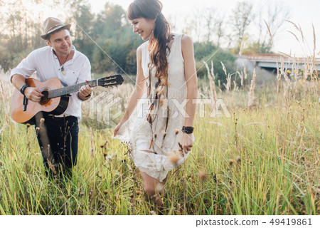 Love story of beautiful young couple at nature 49419861