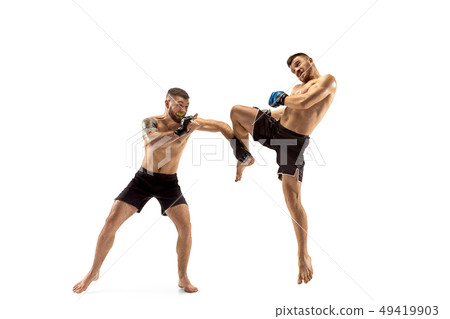 Two professional boxers boxing isolated on white studio background Two professional boxers boxing isolated on white studio background 49419903