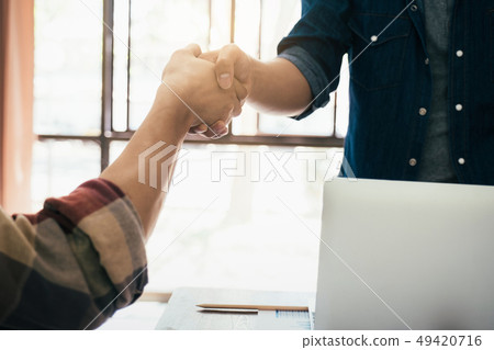 Businessmans handshake after good deal. Businessmans handshake after good deal. 49420716