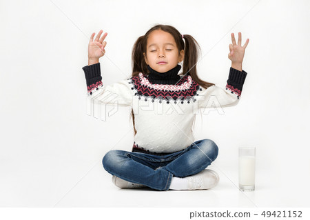 little child girl holding glass of milk on white background little child girl holding glass of milk on white background 49421152