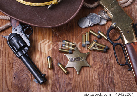 Wild west gun, ammunition and U.S. Marshal Badge Wild west gun, ammunition and U.S. Marshal Badge 49422204