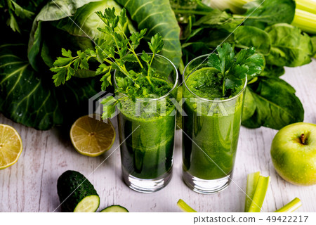 Healthy smoothie for breakfast with green spinach and apple. Healthy smoothie for breakfast with green spinach and apple. 49422217