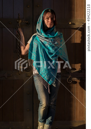 A girl in a Church handkerchief and jeans A girl in a Church handkerchief and jeans 49422218