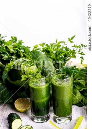 Healthy smoothie for breakfast with green spinach and apple. Healthy smoothie for breakfast with green spinach and apple. 49422219