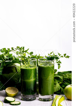 Healthy smoothie for breakfast with green spinach and apple. Healthy smoothie for breakfast with green spinach and apple. 49422220
