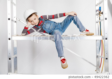 Boy builder in a helmet 49422362