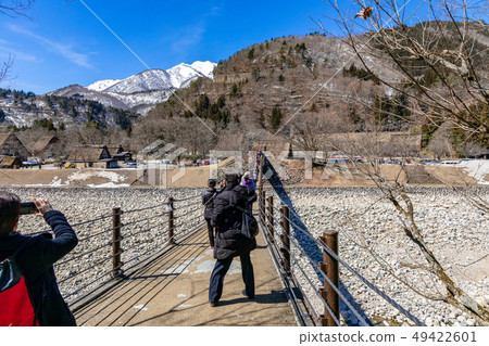 Shirakawago crossing the Aikawa bridge 49422601