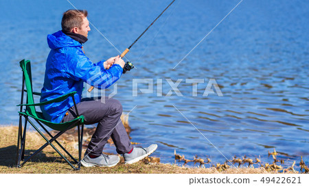 Fishing by spinning. Fisherman Fishing by spinning. Fisherman 49422621