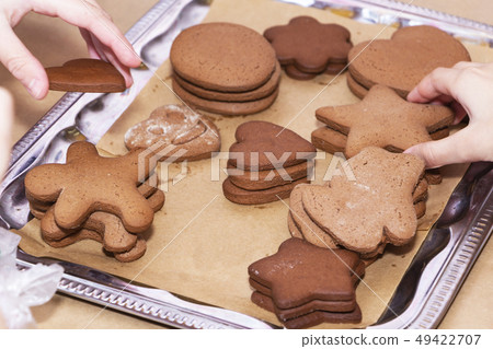 Children's hands reach for freshly baked liver. Children's hands reach for freshly baked liver. 49422707