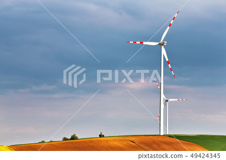 Wind turbines park generating electricity. Hunting 49424345