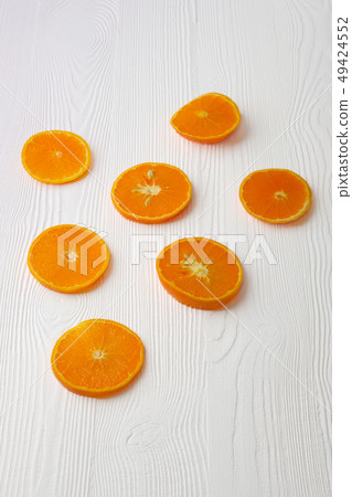 Orange slices on white rustic wooden background, Orange slices on white rustic wooden background, 49424552