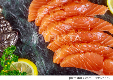 Raw salmon with marble plate background Raw salmon with marble plate background 49425469