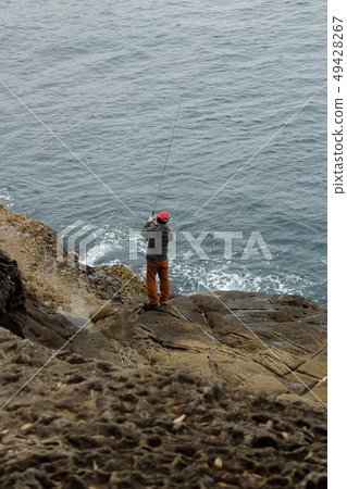 Man fishing for salmon (Onigajo) 49428267