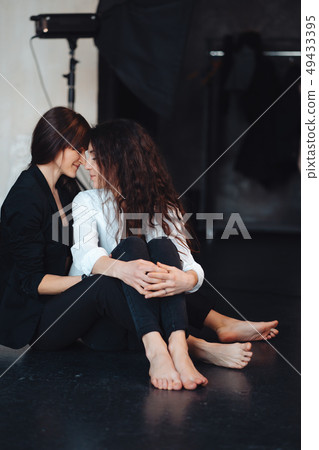 Two girls in each other's tender embraces Two girls in each other's tender embraces 49433395
