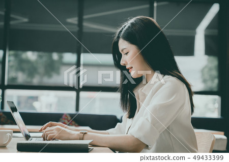 An Asian girl is freelancer woman, she is working An Asian girl is freelancer woman, she is working 49433399