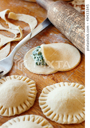 Making ravioli with ricotta cheese and spinach Making ravioli with ricotta cheese and spinach 49433845