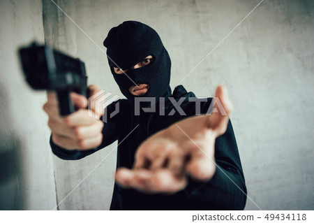 A man holding a gun in hand, the ship ready to 49434118