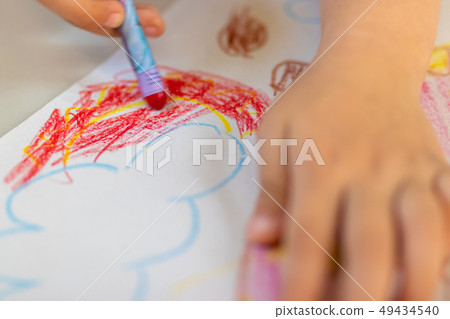 Close up of little hands coloring with Crayon 49434540