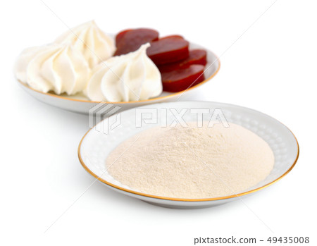 Agar-agar powder on a white plate. On a background Agar-agar powder on a white plate. On a background 49435008