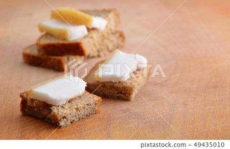 Bacon and bread on the board. Bacon and bread on the board. 49435010