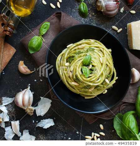 Spaghetti pasta with pesto sauce 49435819