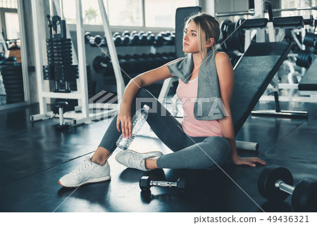 Portrait of Pretty Caucasian Woman is Exercised Portrait of Pretty Caucasian Woman is Exercised 49436321
