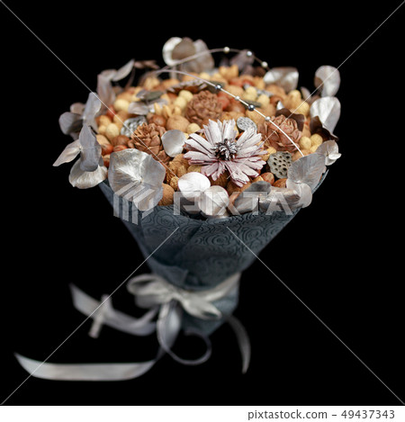 Original gift in the form of bouquet of nuts Original gift in the form of bouquet of nuts 49437343